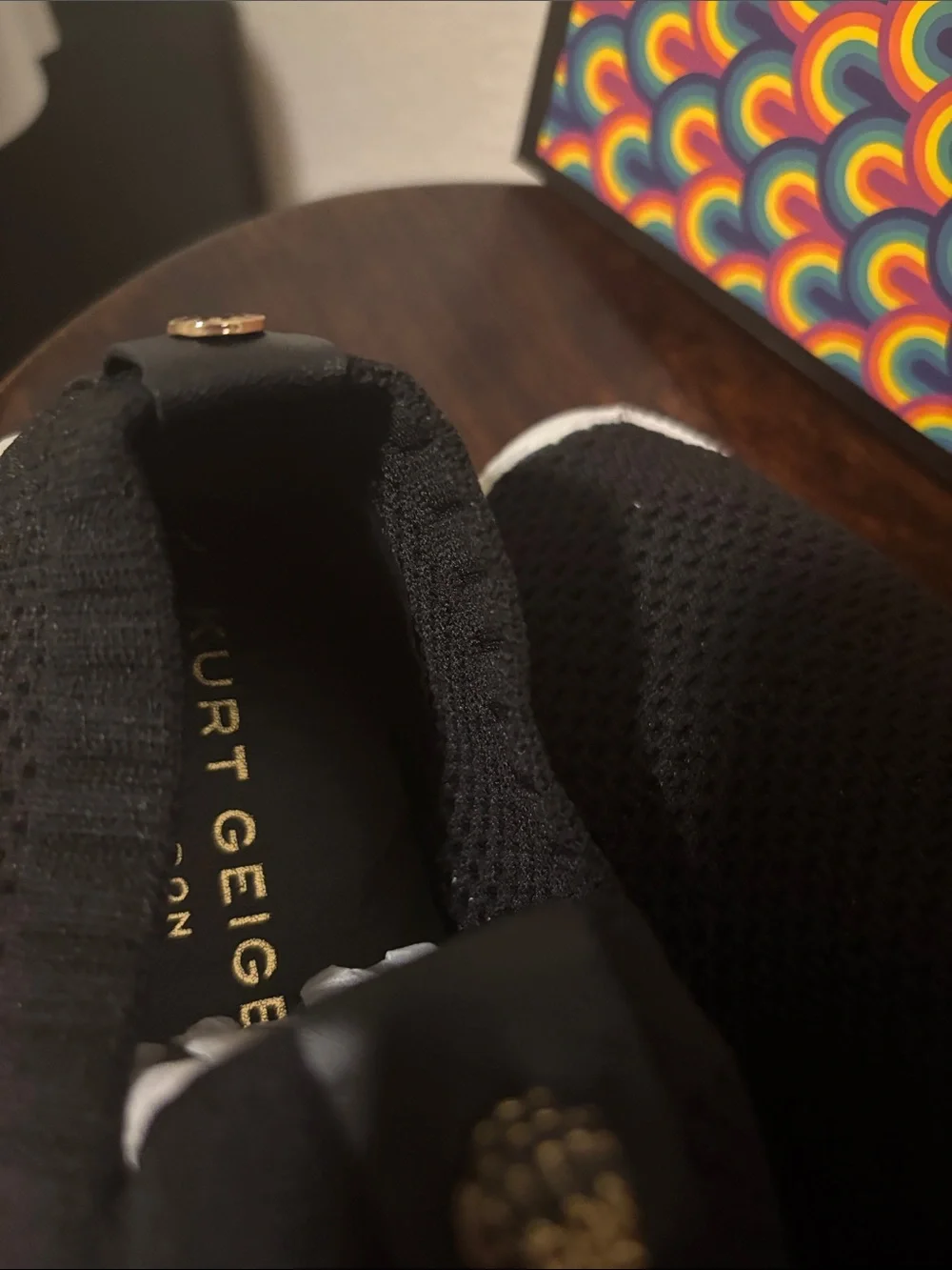 Kurt Geiger Black Knit Slip-On Sneakers with Gold Emblem